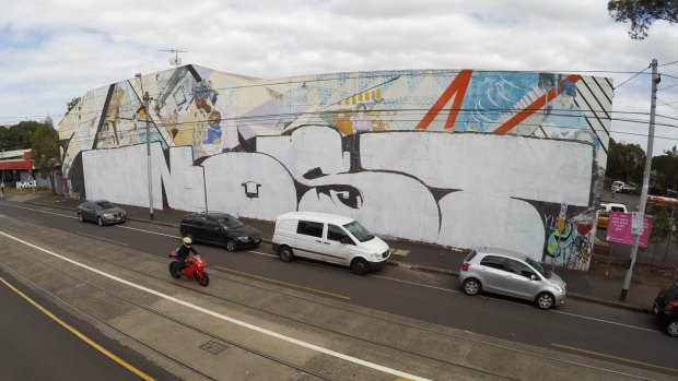The historic Northcote mural after being tagged by Nost.