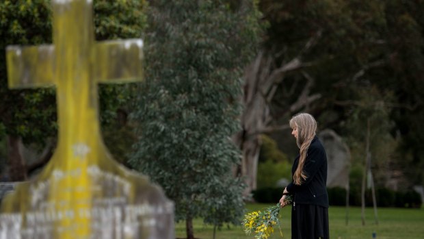 Lucy Sussex at the unmarked grave of writer Mary Fortune at the Springvale Cemetery. 