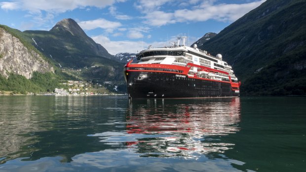 Hurtigruten's Nansen sailing into the Trollfjord in Norway