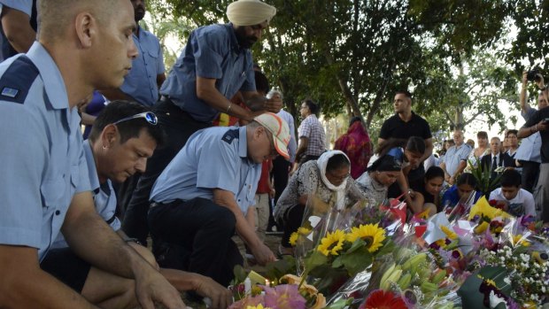 Brisbane bus drivers were among those to pay respect to colleague Manmeet Sharma at a vigil at Moorooka in the days after the attack.