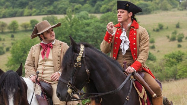 Josh Gad (left) as Lefou and Luke Evans as Gaston in <i>Beauty and the Beast</i>.