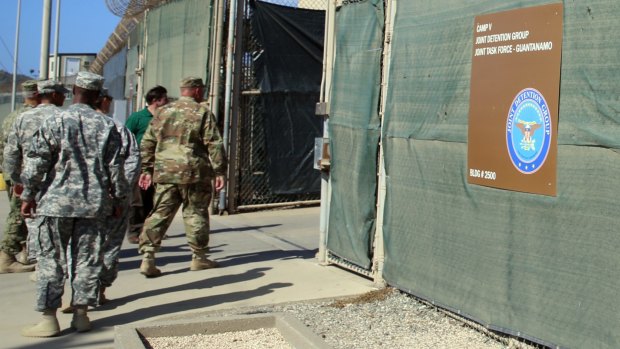 Guards walking into Camp 6 at the US detention centre at Guantanamo Bay, Cuba, in early February.