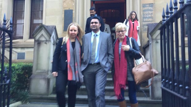 Amarjit Singh, centre, outside the Federal Court on Wednesday.  