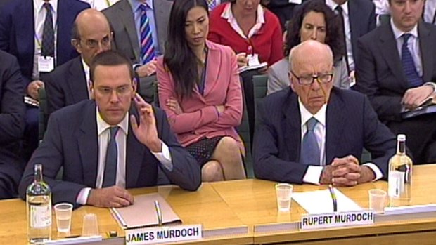 James Murdoch (left) and Rupert Murdoch in July 2011, giving evidence to the Culture, Media and Sport select committee on the News of the World phone-hacking scandal. 