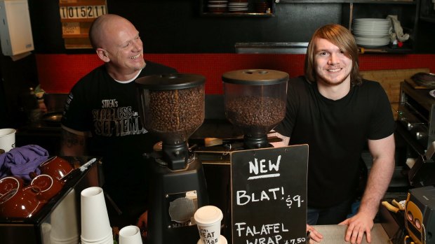 McKillop Street Cafe trainee Joshua Eaves (right),  with STREAT manager of youth services Jarryd Williams. 