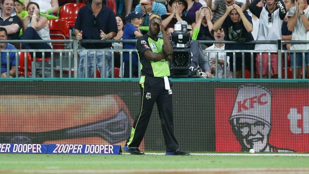 Night to forget: Andre Russell reacts after his dropped catch the deflected over the rope for six.