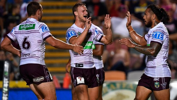 Turning point Jorge Taufua (r) of the Sea Eagles celebrates after scoring a try.
