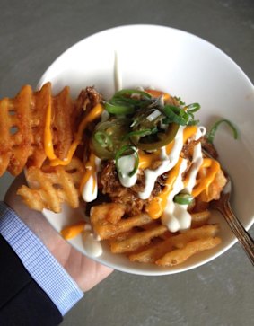 Pulled pork, waffle chips and jalepeno is a new dish on the menu at the footy this year.