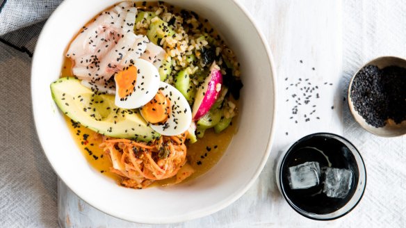 Poke rice salad bowl with kimchi. 