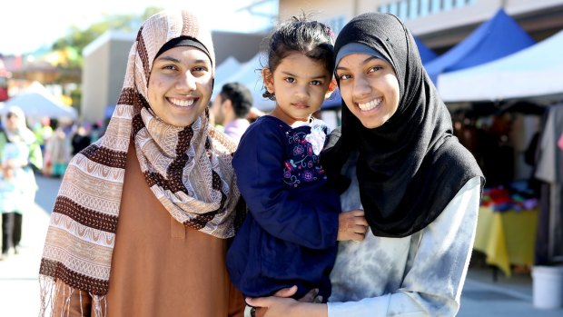 Sisters Yaminah, 13, Fatima, 2, and Sakinah, 12, at the Eid Down Under Festival in Brisbane.
