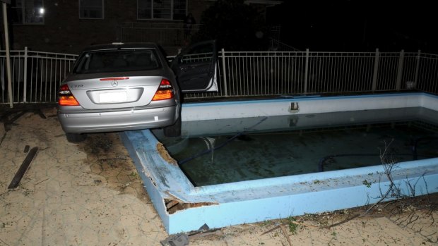 Stolen Mercedes almost drives into pool.