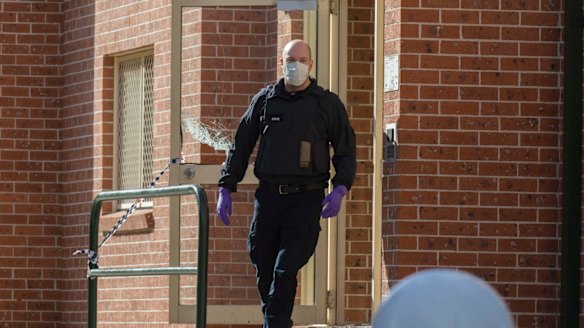 Police smashed their way into glass doors during the raids.