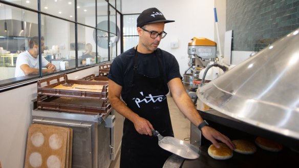 The pita are baked on a hot turntable.