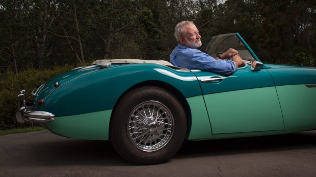 Frank Robson in the restored 1958 Austin-Healey 100-6 roadster, painted Pacific Green over Forest Green.