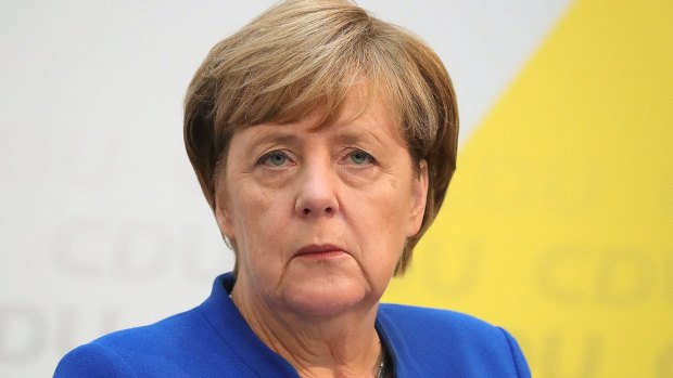 Angela Merkel, Germany's chancellor and Christian Democratic Union (CDU) leader, pauses during a news conference at the party's headquarters in Berlin, Germany.