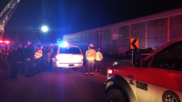 Emergency responders work at the scene of a crash between an Amtrak passenger train and a freight train in Cayce, South Carolina.