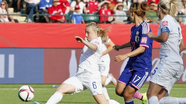 England defender Laura Bassett (6) tries to block a pass during the second half of a Women's World Cup semifinal against Japan in Edmonton, Canada, on July 1, 2015. The ball looped and went in off the underside of the bar, providing Japan a 2-1 victory. Japan will meet the United States in the final for the second tournament in a row. (Kyodo) ==Kyodo England defender Laura Bassett (6) tries to block a pass during the second half of a Women's World Cup semifinal against Japan in Edmonton, Canada, on July 1, 2015. The ball looped and went in off the underside of the bar, providing Japan a 2-1 victory. Japan will meet the United States in the final for the second tournament in a row. (Kyodo) ==Kyodo