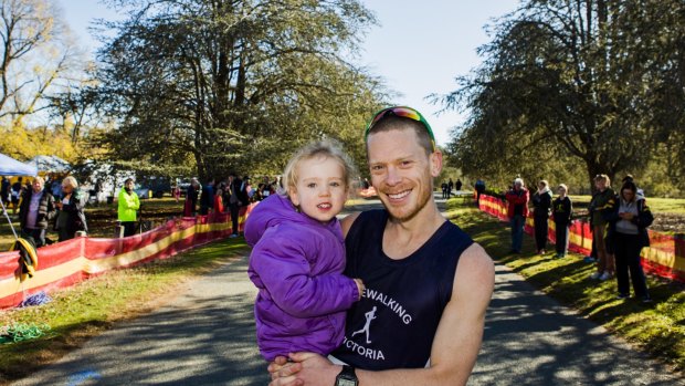Chris Erickson, with his three-year-old daughter Anika, came first in the Lake Burley Griffin walking carnival.