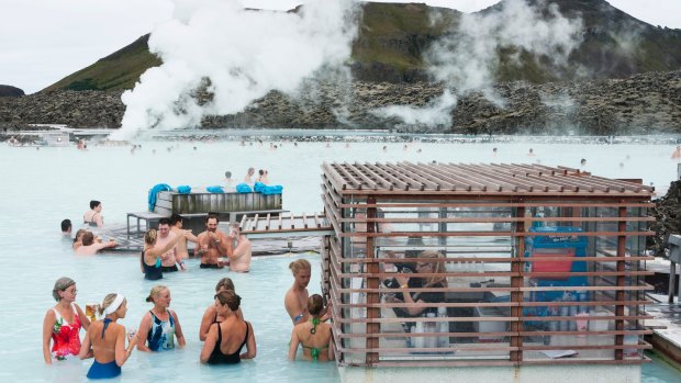 Tourists enjoy a drink at a pool bar in Iceland's Blue Lagoon. 