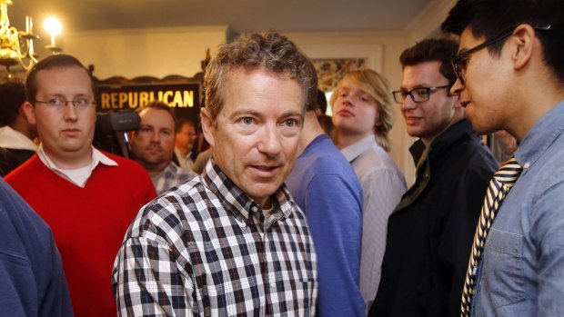 'The Republican Party brand sucks and so people don't want to be a Republican': Senator Rand Paul walks through a crowd of young Republicans at state party HQ in New Hampshire. 