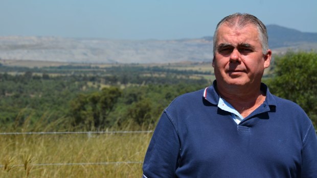 Peter Brown's property is surrounded by coal mines, but he is unable to require the mines to buy him out due to NSW's mining land acquisition policy.