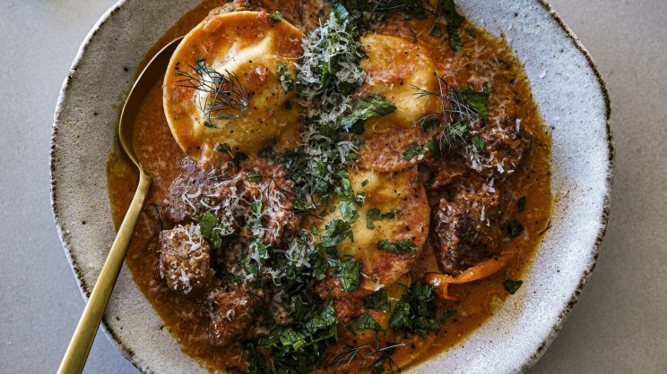 One-pan slurpy creamy tomato ravioli with spicy sausage