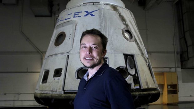 Tesla CEO Elon Musk with the SpaceX Dragon capsule.