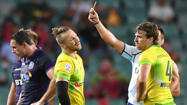 Australia's Tom Connor can't believe his luck when shown a yellow card against Scotland.