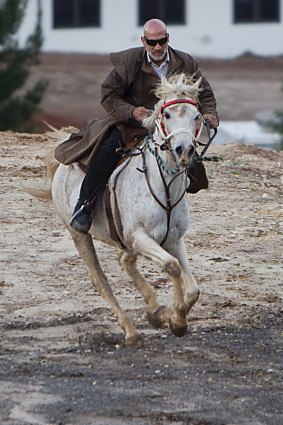 Mamdouh Elomar during a solitary ride at is Sydney property after news his son Momhamed was killed in Syria.