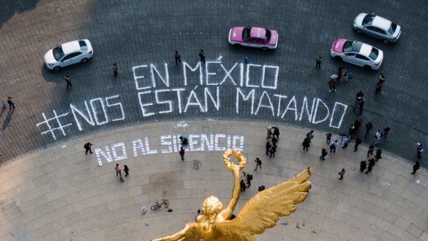 A bird's eye view of the Angel of Independence monument where a dozen reporters gathered to write, "In Mexico they are killing us," and "No to silence" to draw attention to a wave of journalist killings.
