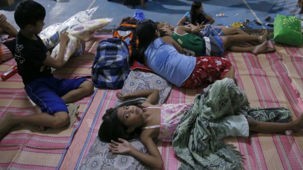Typhoon evacuees are housed in a school gymnasium in Cabanatuan, northern Philippines.