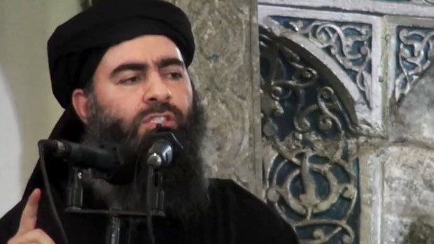 Wanted: Islamic State group chief Abu Bakr al-Baghdadi, who has a $US10 million price on his head, delivers a sermon at a mosque in Iraq in July.