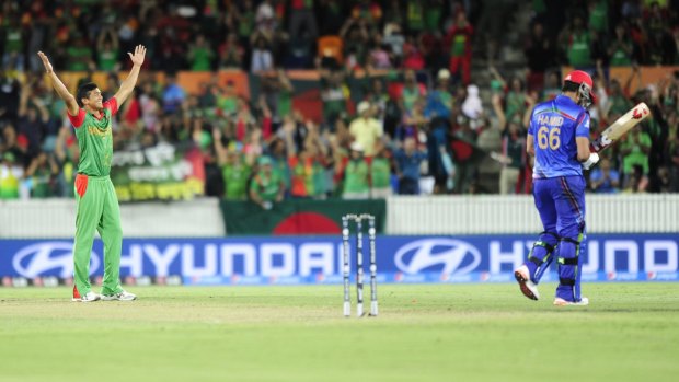 Bangladesh bowler Ahmed Taskin celebrates their win against Afghanistan at Manuka Oval during the ODI World Cup.