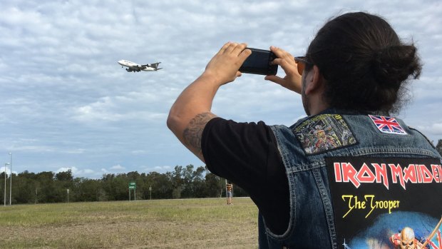 Iron Maiden fan Dan Taylor watches Ed Force One on final approach into Brisbane Airport.