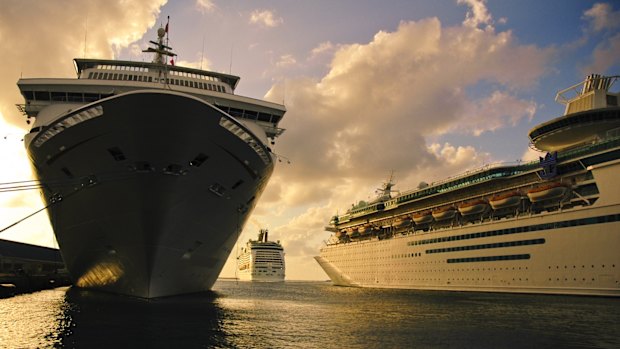 Cruise ships anchored at Nassau Cruise Port, one of the busiest ports in the Caribbean, at sunset.