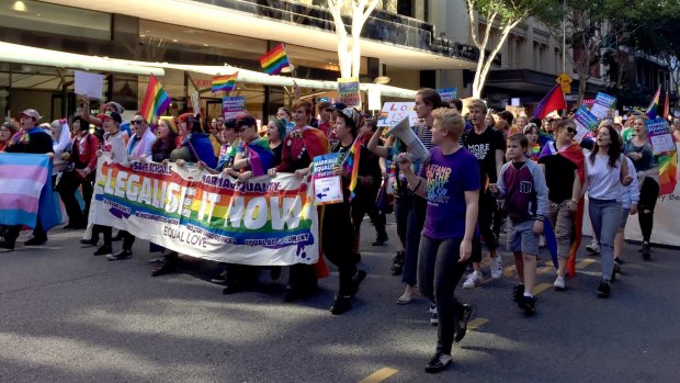 Marriage equality supporters march through Brisbane streets on Saturday afternoon.