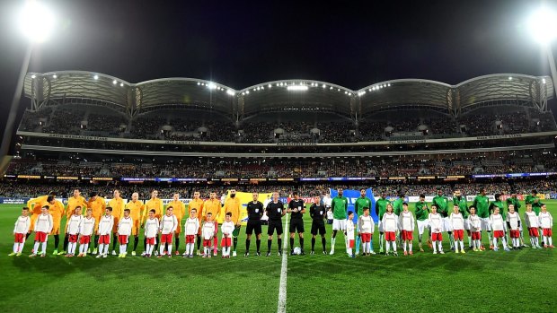 Both teams line up for the national anthems. Saudi Arabia caused controversy when their players did not observe the minute's silence in the traditional way. 