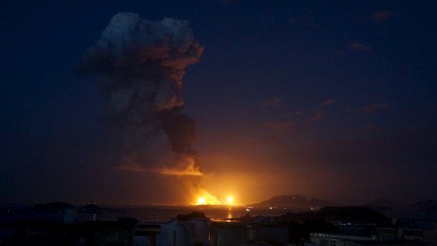 Smoke rises after an explosion at a chemical plant that produces paraxylene, or PX, a chemical used in polyester fibre and plastics, in Zhangzhou, Fujian province. 