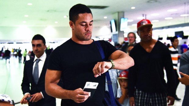 Time to fly: Jarryd Hayne with friends and family at Sydney Airport on Monday before leaving for San Francisco.