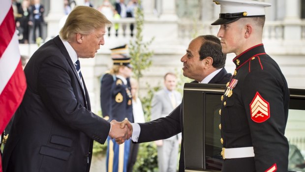 US President Donald Trump, left, shakes hands with Abdel-Fattah El-Sisi, Egypt's president, as he arrives at the West Wing of the White House in Washington, DC.