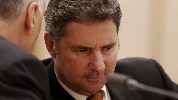 Larry Marshall, chief executive of CSIRO, confers with deputy Craig Roy at one of the Senate committee hearings in April.