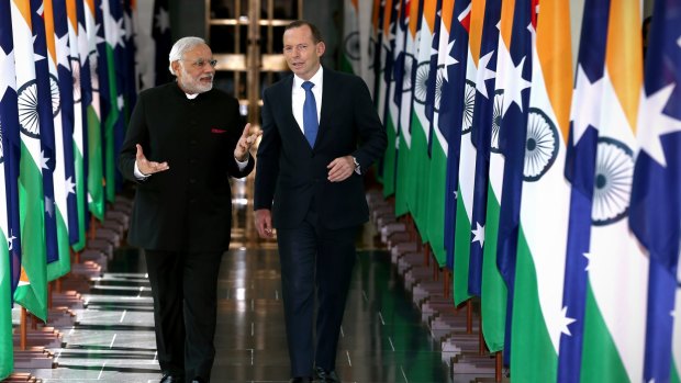 Playing the game: Indian Prime Minister Narendra Modi and Prime Minister Tony Abbott depart the House of Representatives.