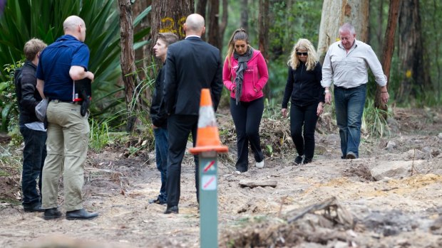 Faye and Mark Leveson inspecting the area where police have been searching for the remains of their son Matthew.