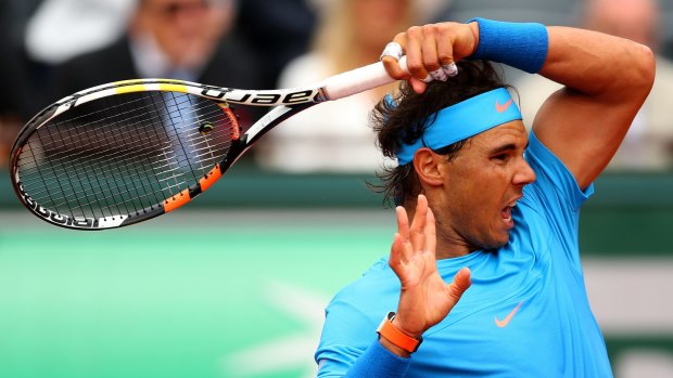 First-up win: Rafael Nadal of Spain returns a shot in against Quentin Halys.