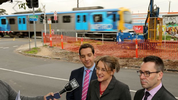 Mark Wild, right, appears with State Minister for Public Transport Jacinta Allan and the member for Oakleigh, Steve Dimopoulos in Melbourne in June for an announcement about next generation,high-capacity trains.