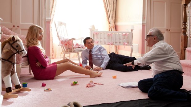 Margot Robbie with Martin Scorsese  and Leonardo DiCaprio in <i>The Wolf of Wall Street</i>.