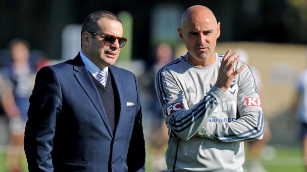 Melbourne Victory coach Kevin Muscat (right) chats with chairman Anthony Di Pietro. 
