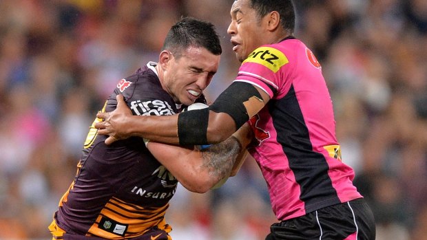 BRISBANE, AUSTRALIA - MAY 08: Darius Boyd of the Broncos attempts to break away from the defence during the round nine NRL match between the Brisbane Broncos and the Penrith Panthers at Suncorp Stadium on May 8, 2015 in Brisbane, Australia.  (Photo by Bradley Kanaris/Getty Images)