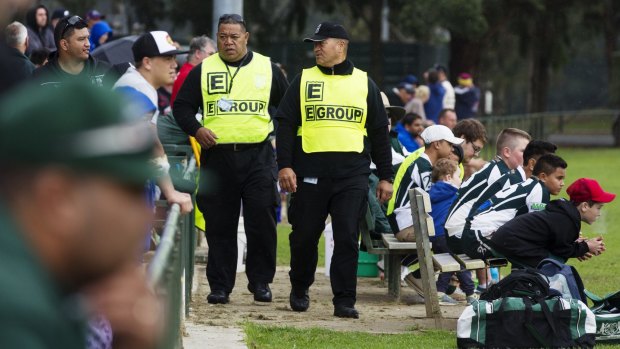 Precautions: Security guards Tonga Koli (left) and Itilani Latu from E Group security patrolling the Penrith and districts Junior Rugby League matches.