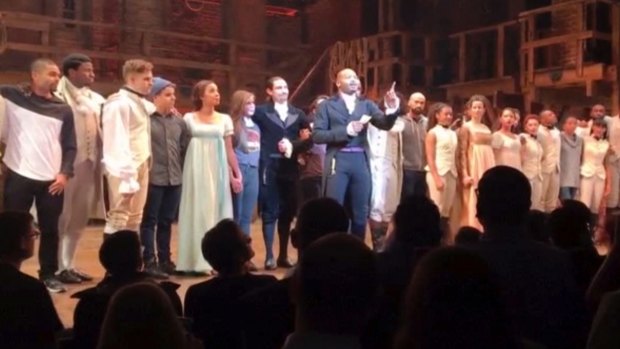 Actor Brandon Victor Dixon who plays Arron Burr in Hamilton, speaks from the stage after the curtain call in New York.